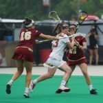 group of woman playing lacrosse